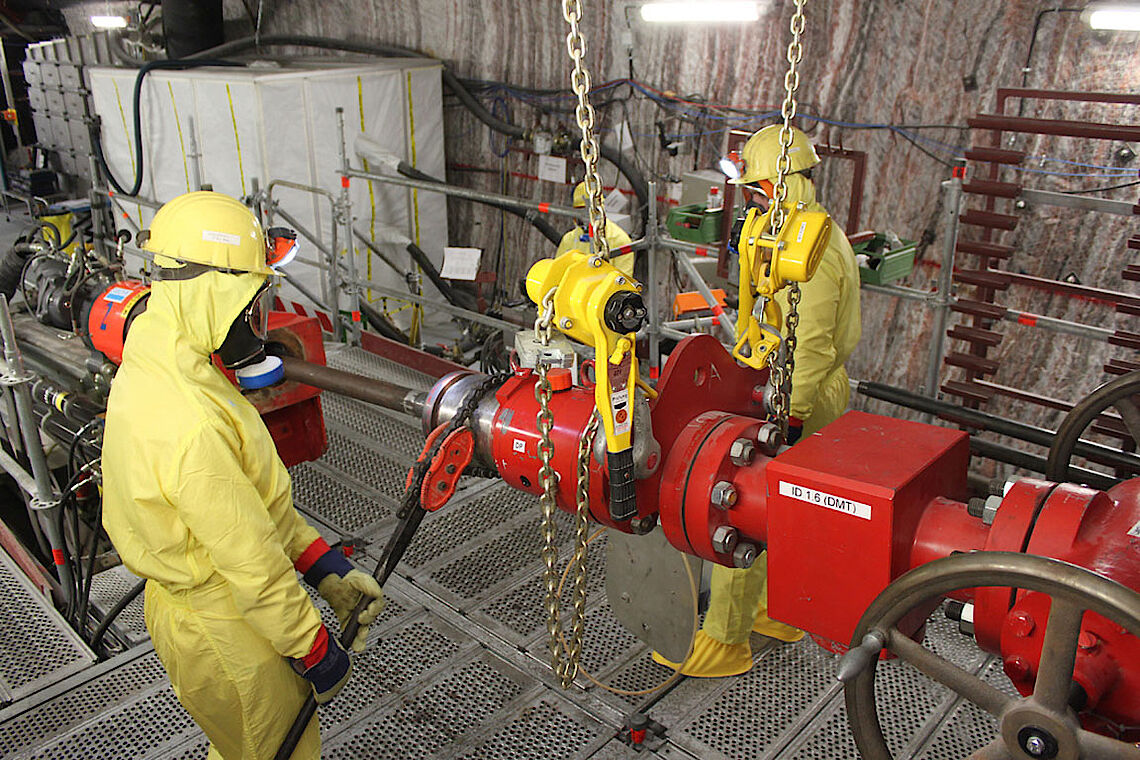 Closing the rotary blow-out preventer in full protective clothing