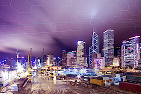 Construction site in front of a modern skyline | DMT GROUP Construction site in front of a modern skyline | DMT GROUP