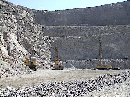 Blasthole drilling in an iron ore open pit mine Blasthole drilling in an iron ore open pit mine